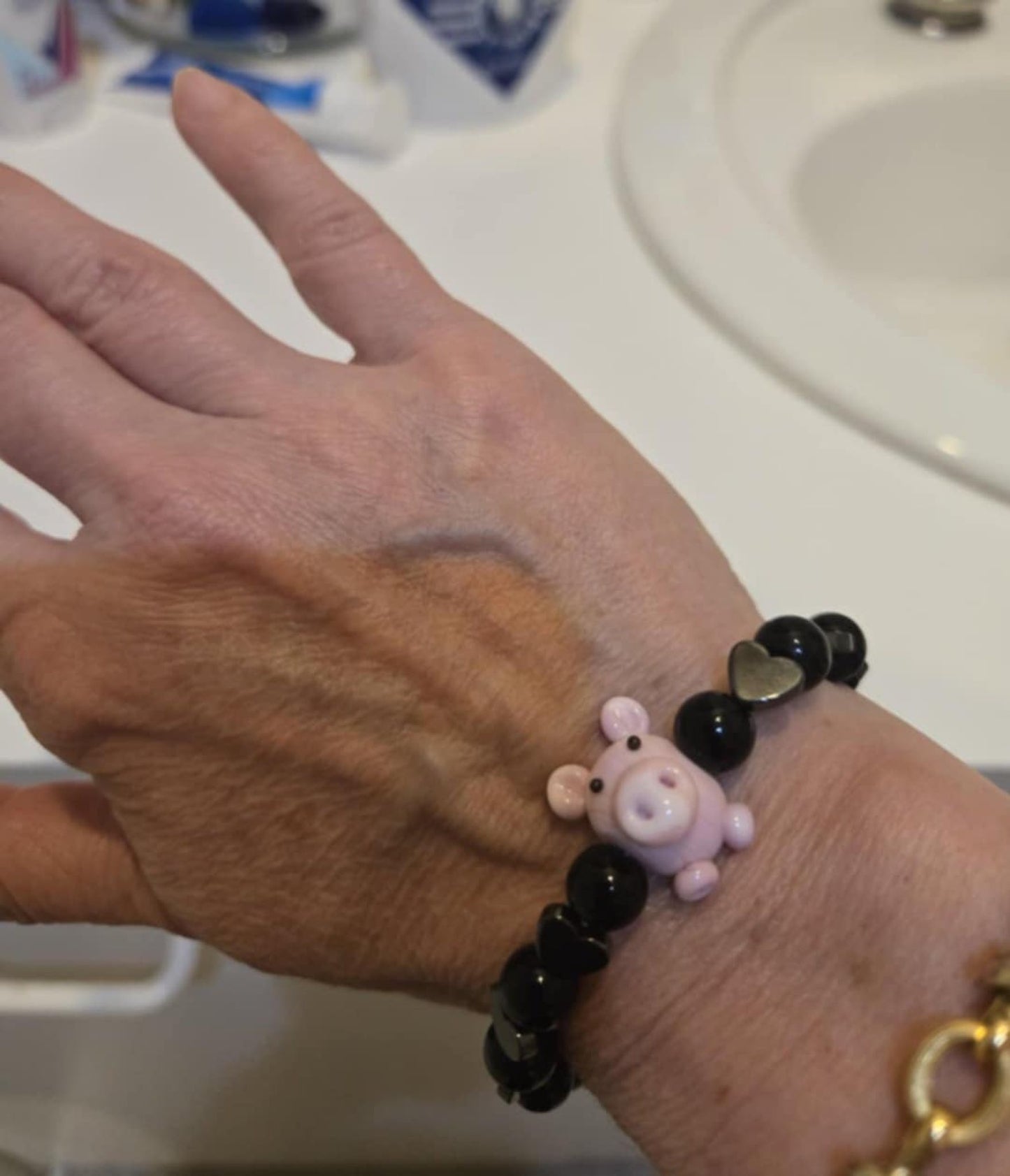 Black hematite bead with glass pig stretch bracelet