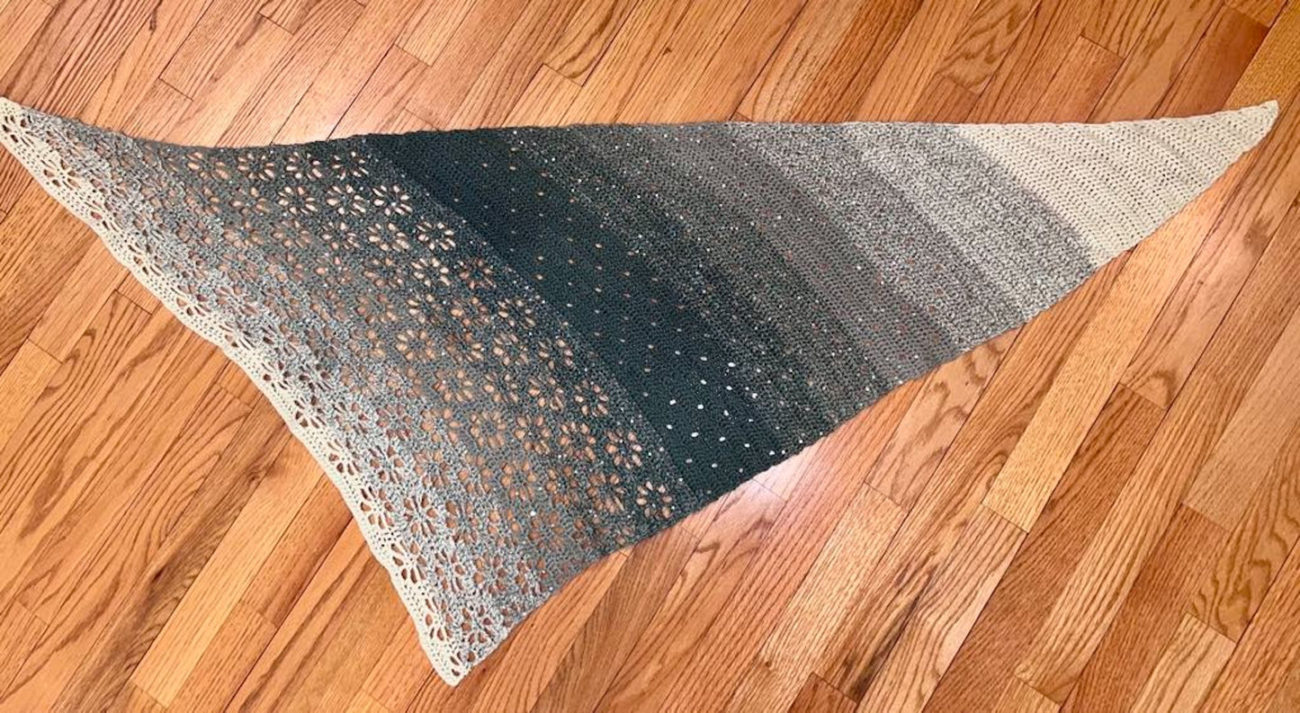 Crocheted shawl from acrylic yarn in green tones with lots of sparkle.