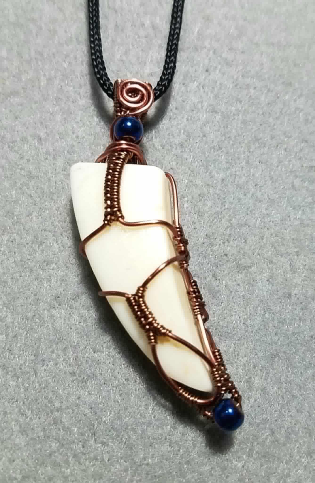Wire wrapped tusk pendant