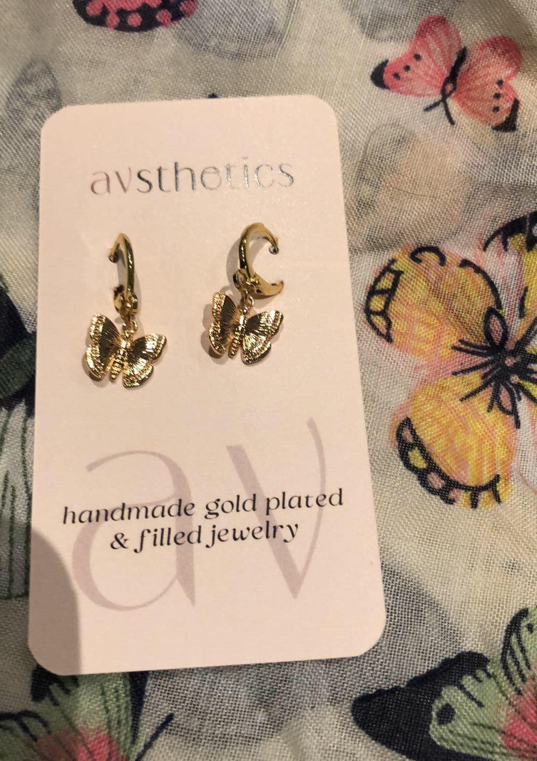 Pair of gold plated butterfly dangle earrings