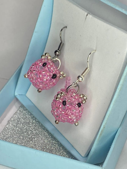 Hot pink beaded pig earrings