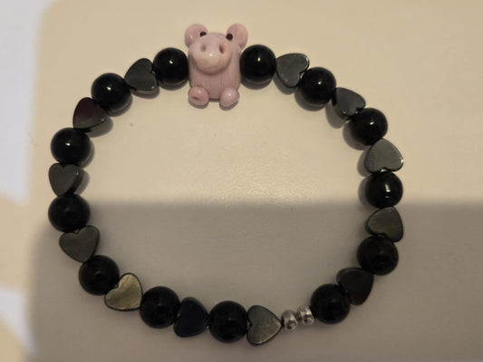 Black hematite bead with glass pig stretch bracelet