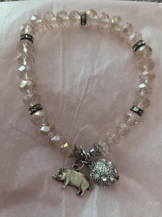 Faceted bead bracelet with pig charm