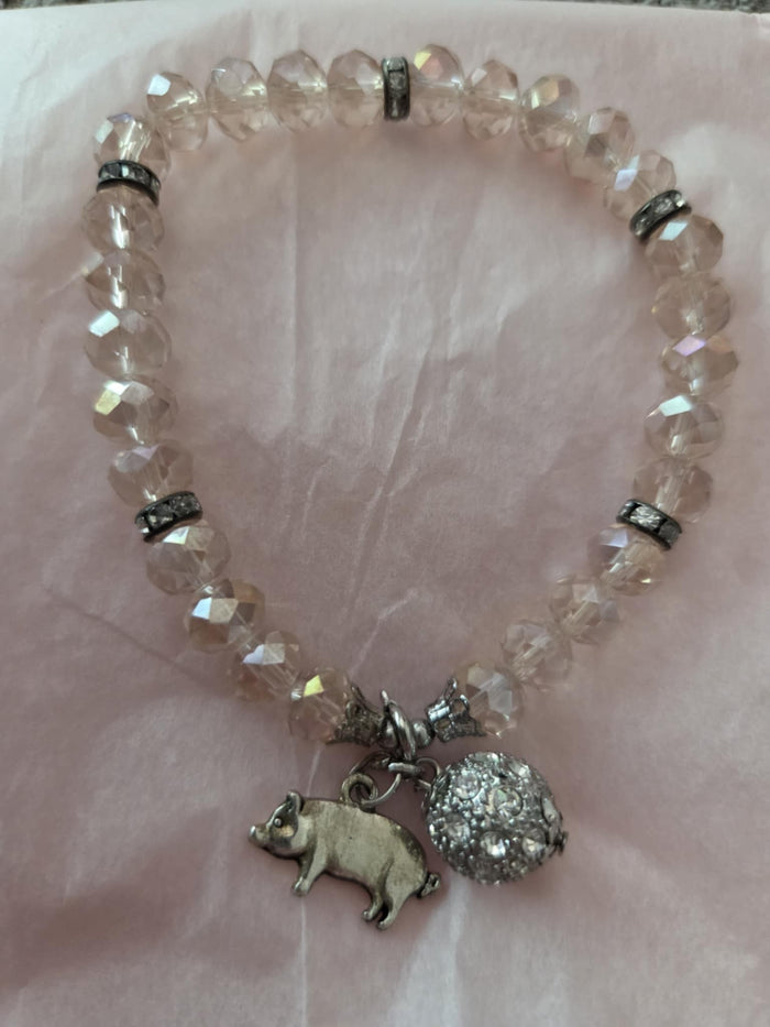 Faceted bead bracelet with pig charm