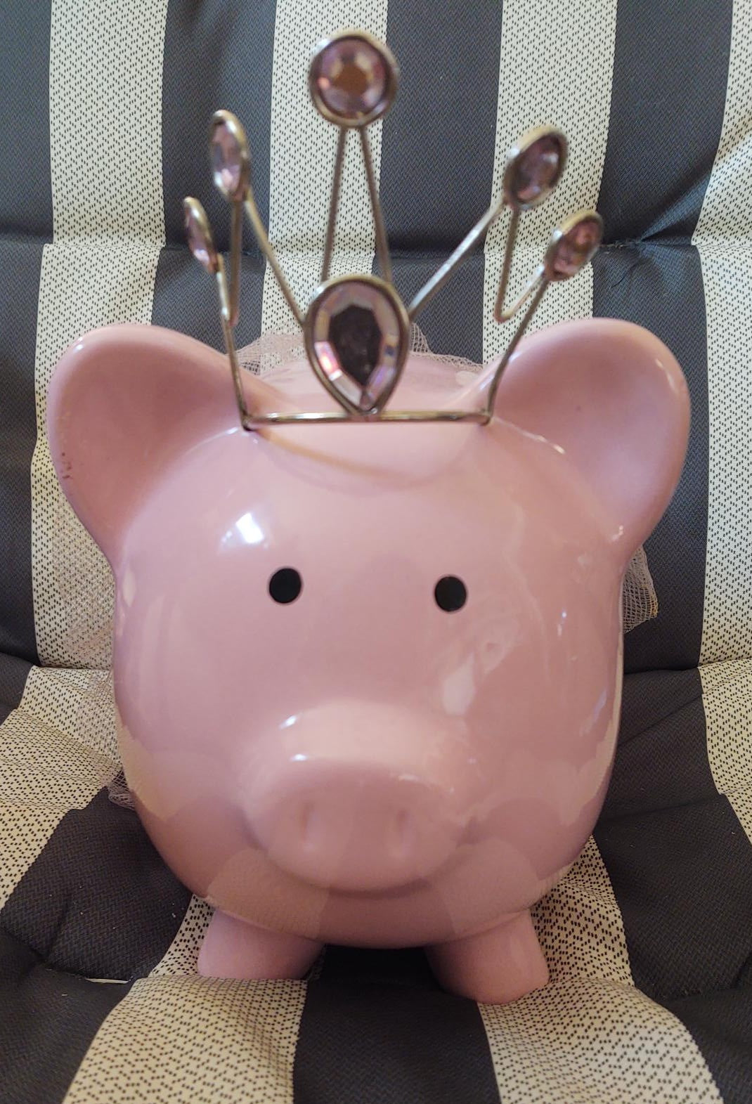 Large pink piggy bank with bejeweled crown